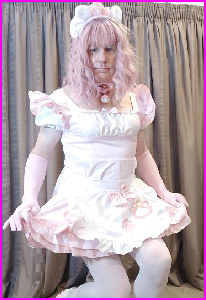 Prissy sissy maid Jacqui curtseys in pink uniform
