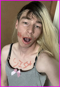 Sissy Gina with whore scrawled on his face in shameful body writing