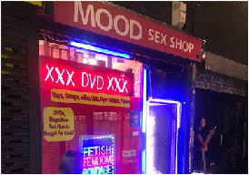 Neon-lit signs of Mood Sex shop in Soho